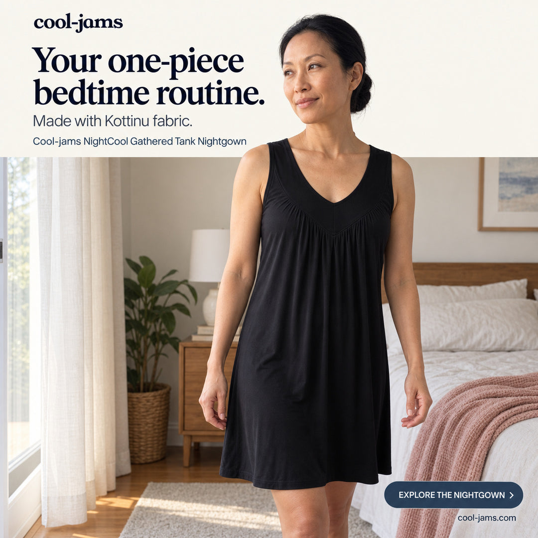 Woman in a black Women's NightCool Gathered Tank Nightgown beside a sunlit bed, a sleeveless cooling nightgown for menopause night sweats