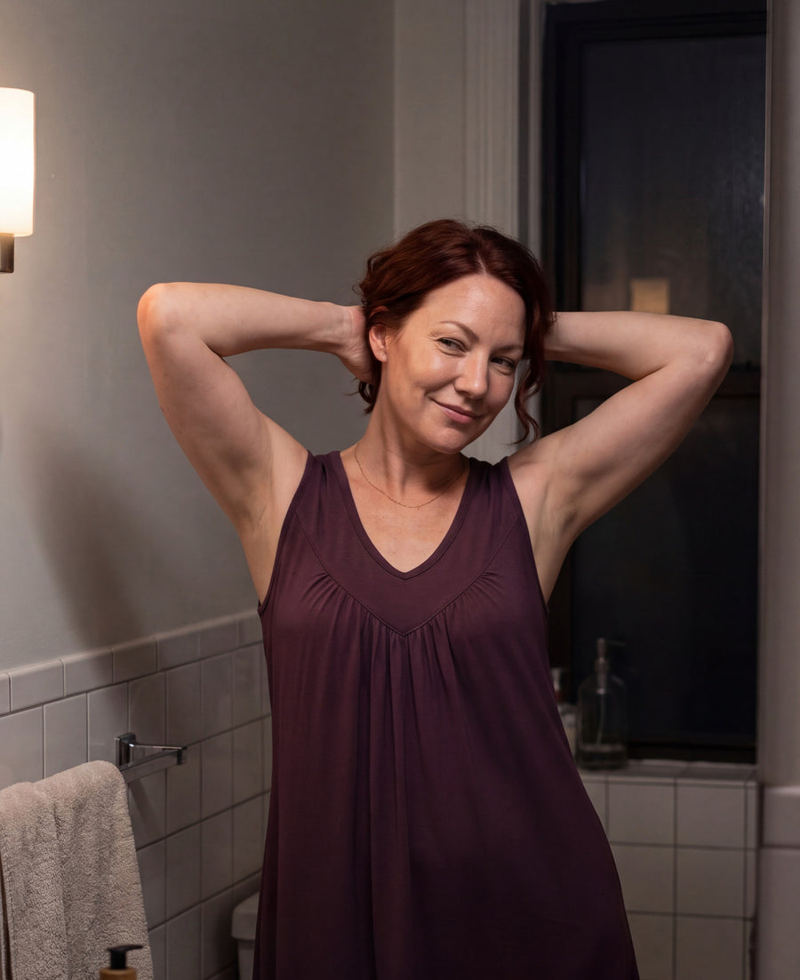 Woman in the merlot Women's NightCool Gathered Tank Nightgown, arms raised, showing the gathered front and wide straps