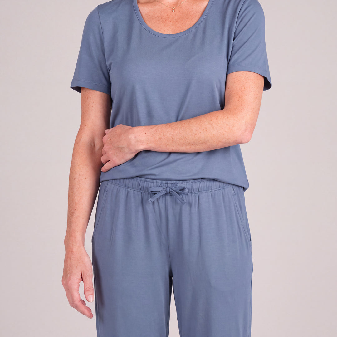 Dusk Blue Cool-jams NightCool Pants for women, close-up, forearm across her waist