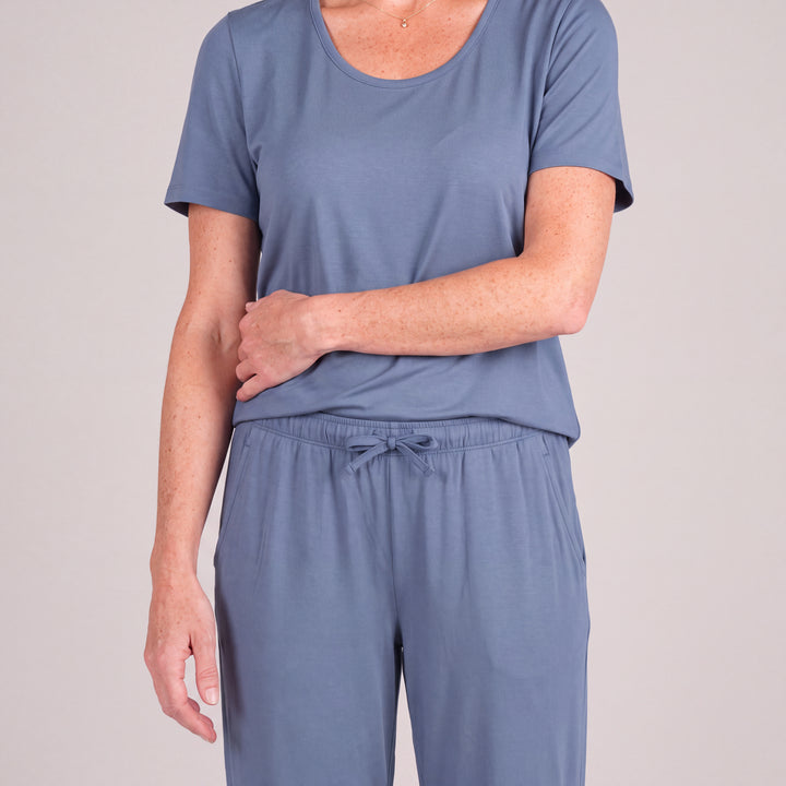 Dusk Blue Cool-jams NightCool Pants for women, close-up, forearm across her waist