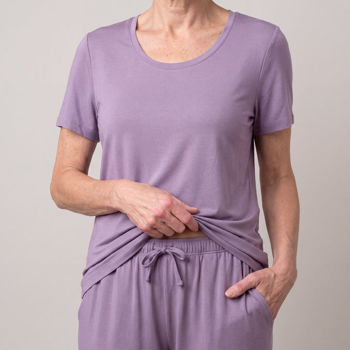 Violet Cool-jams NightCool Pants for women, close-up, holding the hem, a hand in the pocket