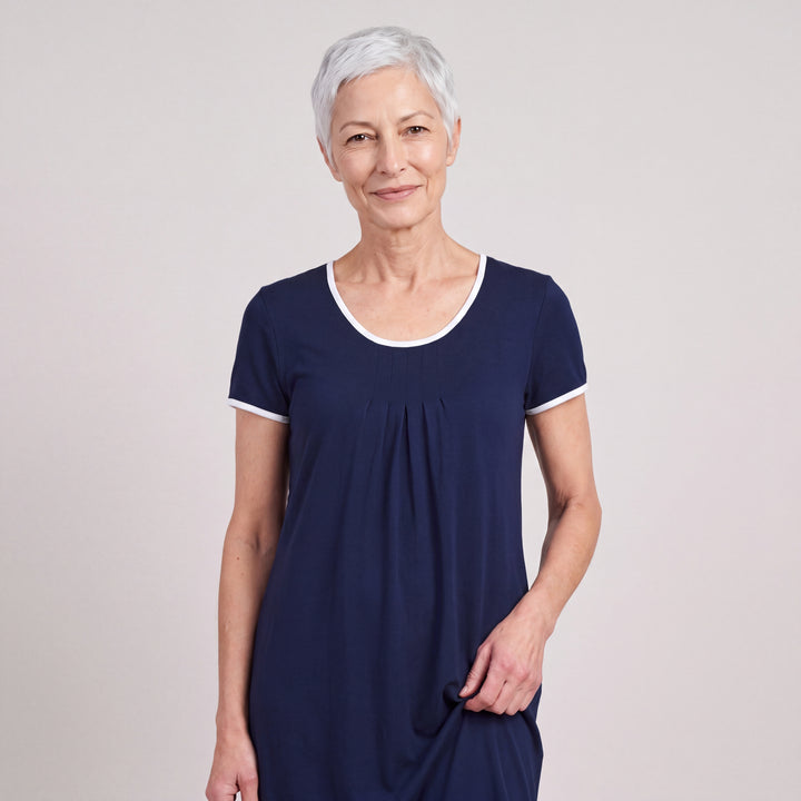Navy Cool-jams NightCool Pleated Front Short Sleeve Nightie for women, short sleeves, soft pleated front and white trim at the neckline and sleeves, close-up of the pleated front and neckline