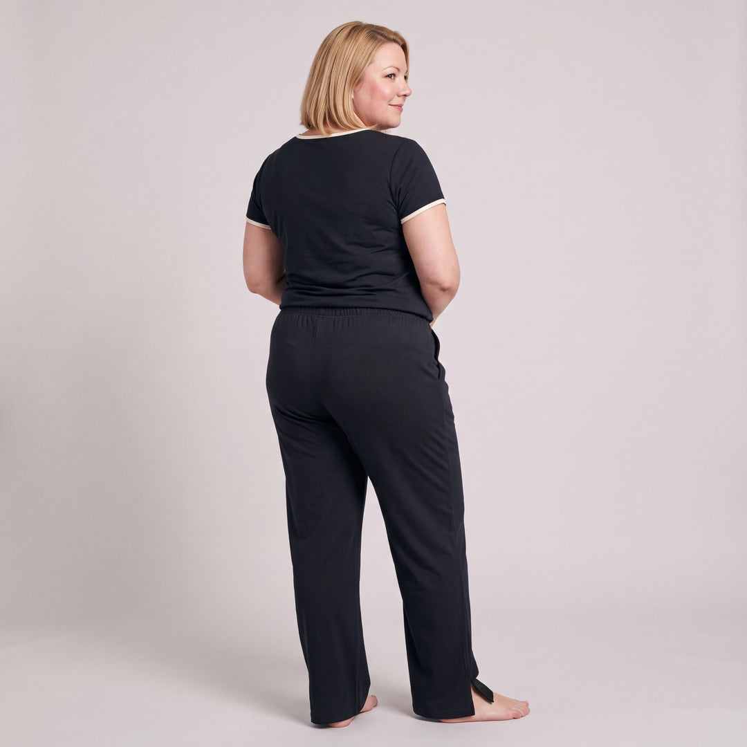 Black Cool-jams NightCool Pleated T-Shirt for women with cream binding, worn with matching drawstring pants, back view, full length