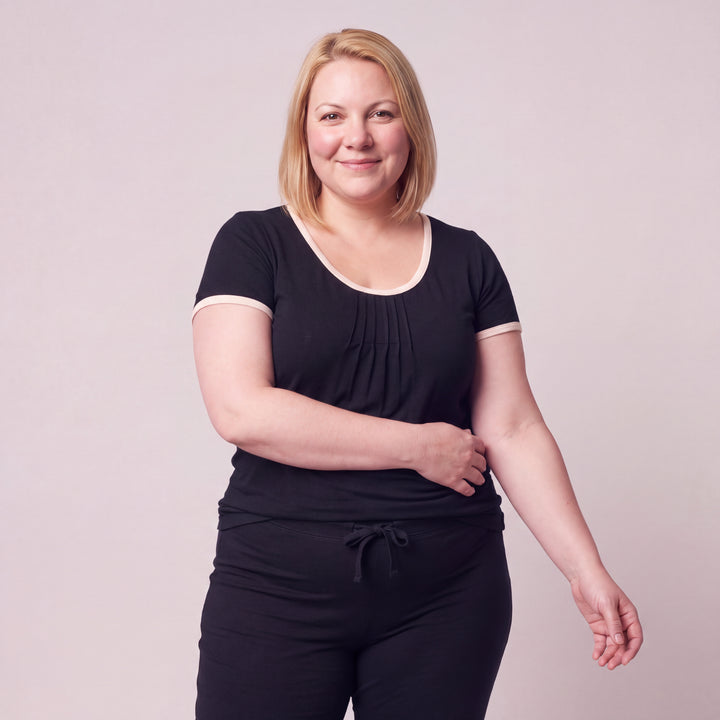 Black Cool-jams NightCool Pleated T-Shirt for women with cream binding, worn with matching drawstring pants, close-up from head to hips