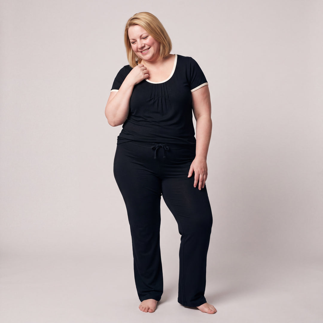 Black Cool-jams NightCool Pleated T-Shirt for women with cream binding, worn with matching drawstring pants, side view, full length