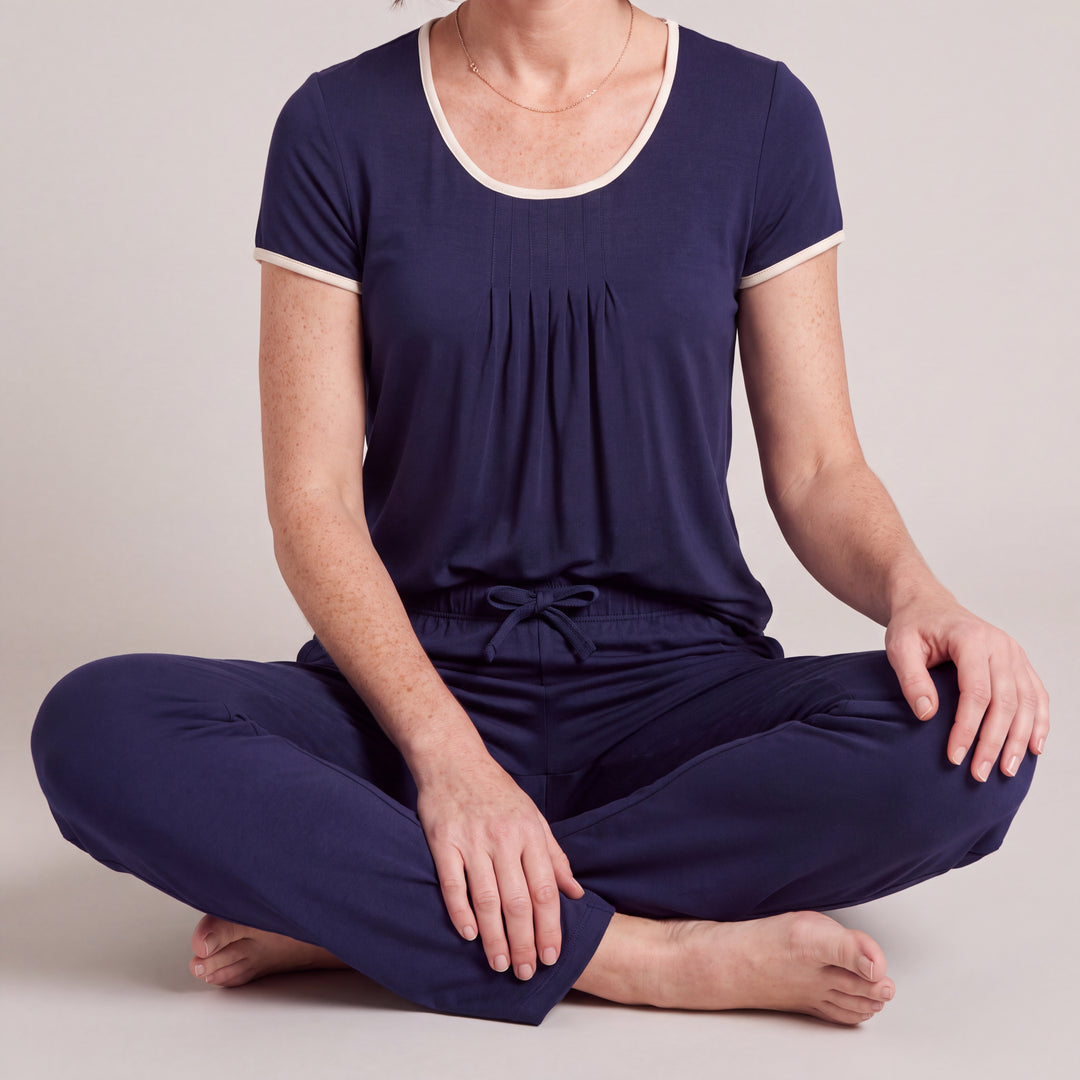 Navy Cool-jams NightCool Pleated T-Shirt for women, close-up, seated cross-legged, the full set