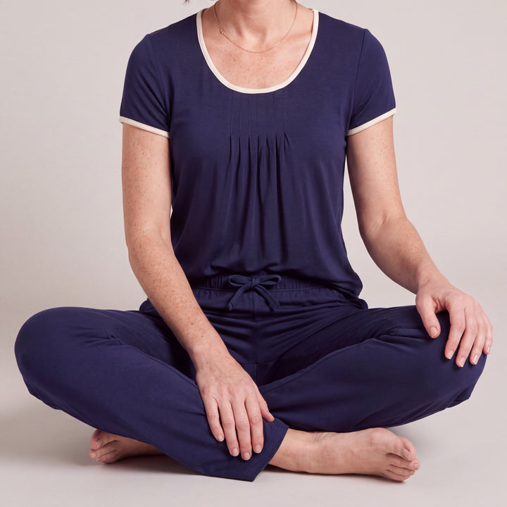 Navy Cool-jams NightCool Pleated T-Shirt for women, close-up, seated cross-legged, the full set