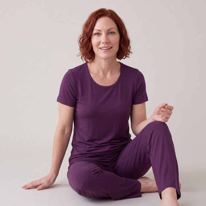 Merlot Cool-jams NightCool Scoop T-Shirt for women, worn with matching pants, model seated on the floor