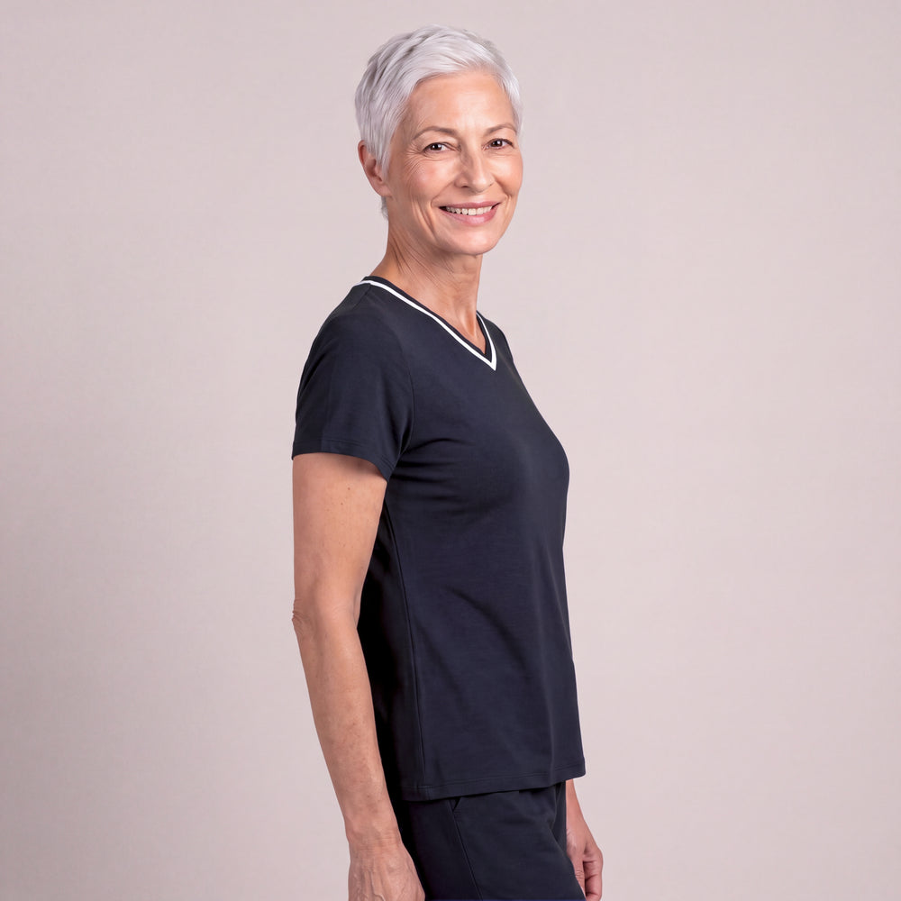 Navy Cool-jams Women's NightCool V-Neck Top, side view on a greige backdrop, short sleeves and a white-trimmed V-neck, worn with matching pants sold separately, breathable sleepwear for warm nights